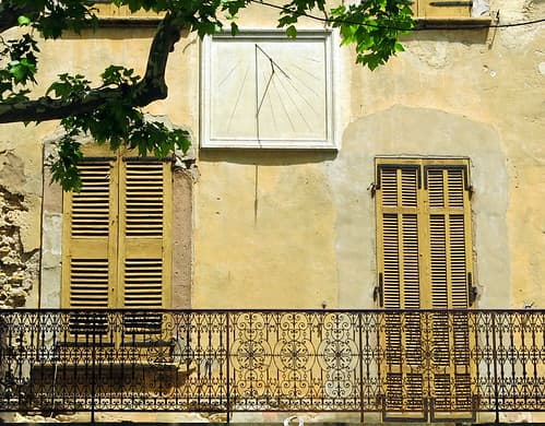 Yellow balcony with sundial, Tourtour, Var, Provence, France
