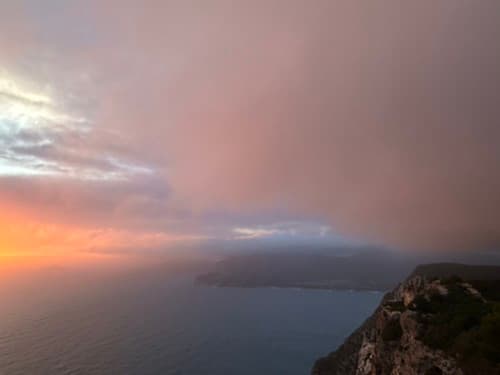 Cloudy sunset on the Cap Canaille cliffs over the Mediterranean Sea near La Ciotat, Provence-Alpes-Côte d'Azur, France, October 2023