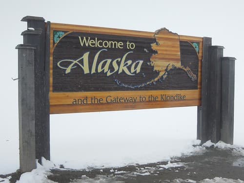 USA (Skagway, Alaska) Border sign between Alaska and British Columbia