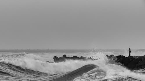 The Man Defying the Waves