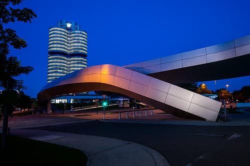 BMW office headquarters in Munich, behind the irregular and artistic metal bridge of the exhibition space BMW-World.