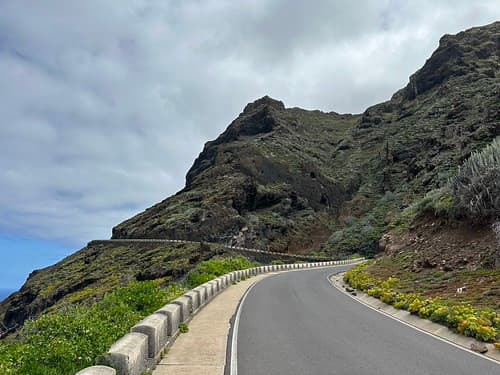 Winding road through rocky mountain coastal landscape near Buenavista del Norte, Canary Islands, Spain, March 2023