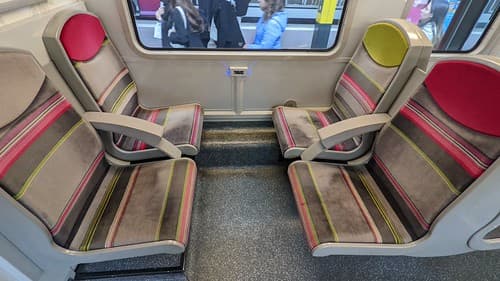 Facing seats with USB port inside a SNCF Class Z 20500 train at Versailles Château Rive Gauche Station in Versaille, France