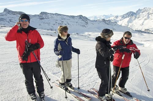 "HELLO! YES! YOU'LL HAVE TO SPEAK UP I'M SKIING!"