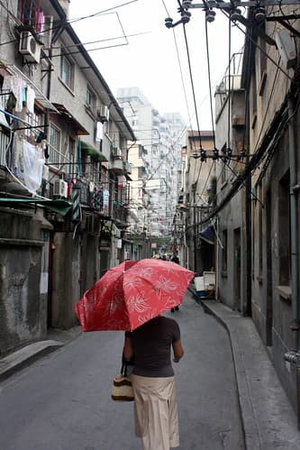 Red Umbrella walking in Shanghai