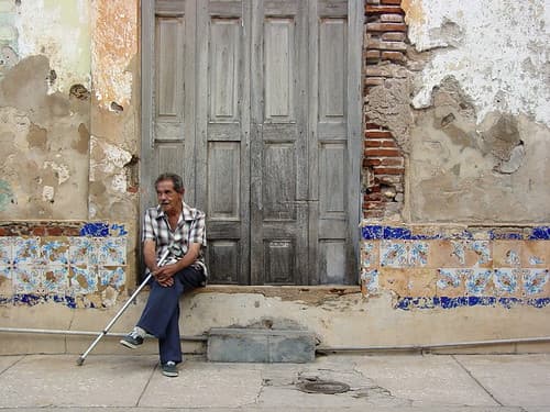 Man and Weathered Facade - Santiago de Cuba - Cuba