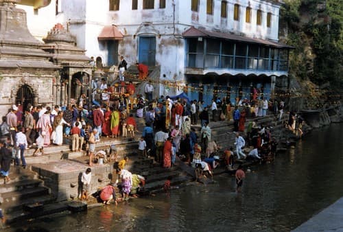 Bagmati River, considered a holy river by Hindus and Buddhists, people washing.