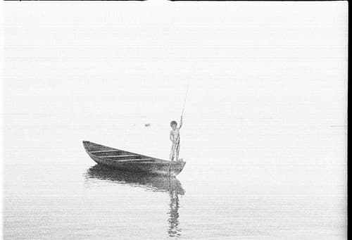 35mm negative by Oskar Speck depicting a child in a canoe