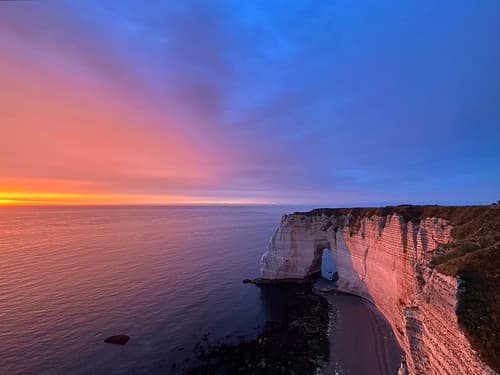 Purple sunset over the Cliffs of Étretat and English Channel, Normandy, France, July 2024