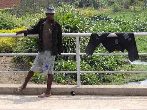 Young Man on Bridge with Drying Trousers - Musanze (Ruhengeri) - Northern Rwanda